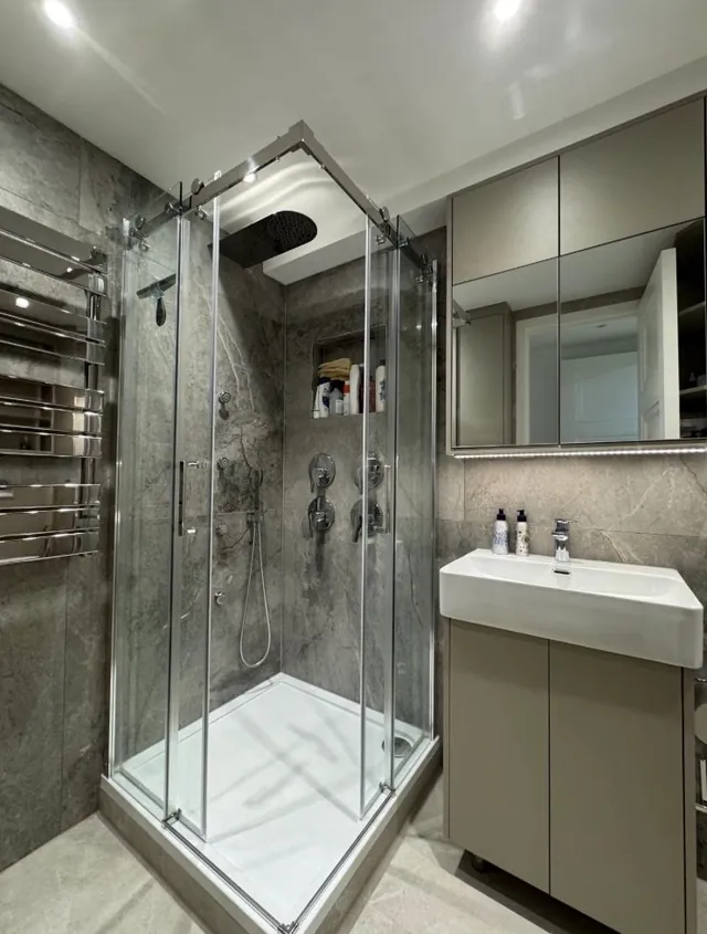 Corner shower enclosure with vanity unit