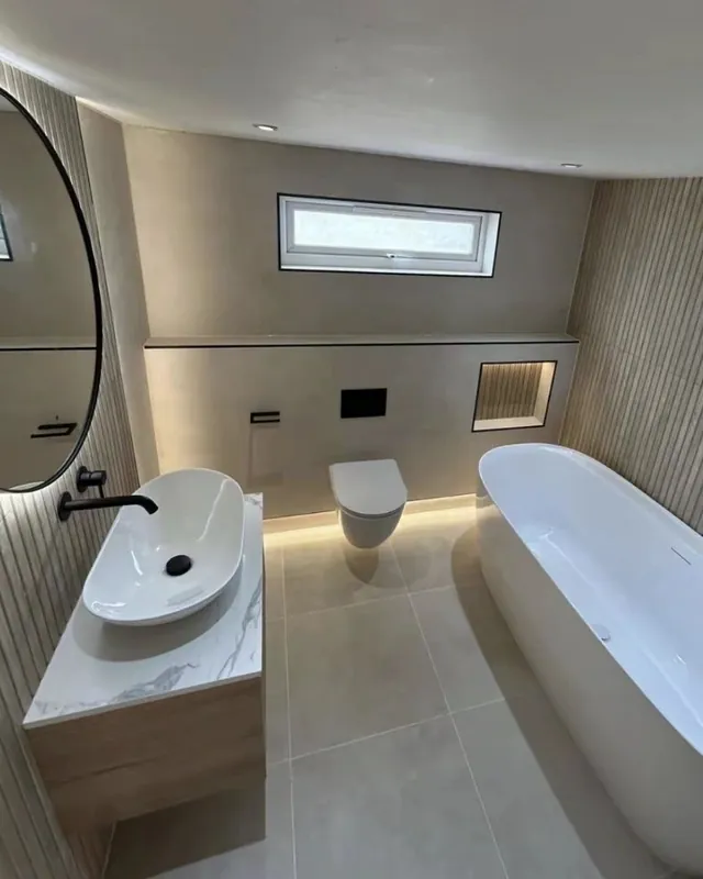 Freestanding bath with timber slat wall and LED lighting