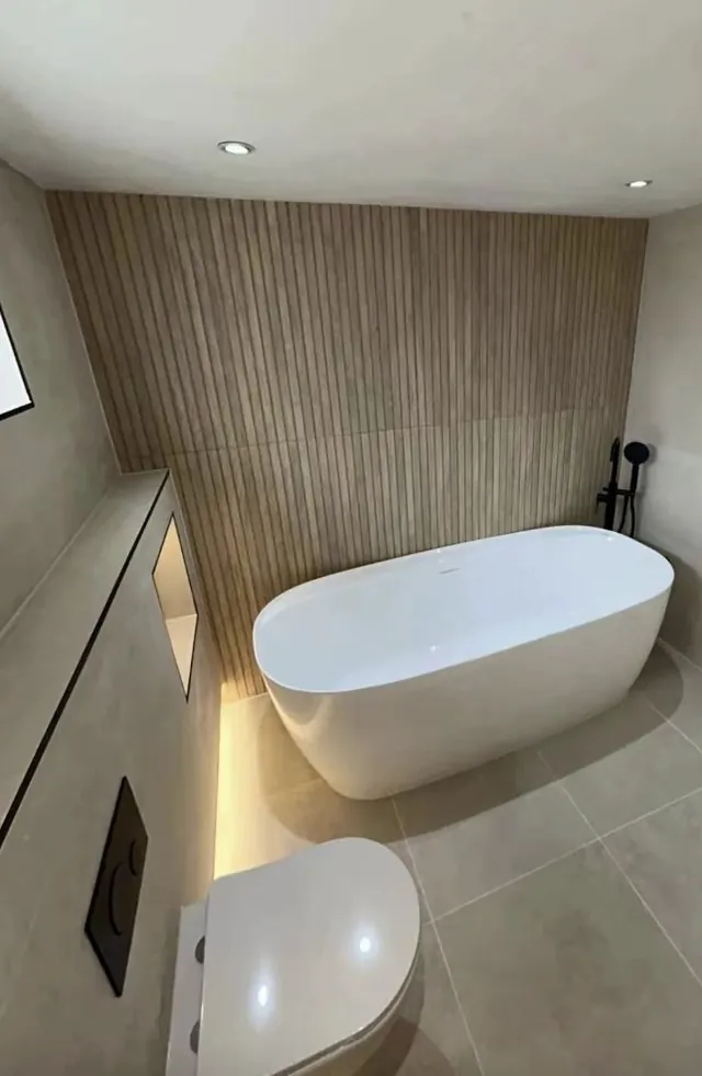 Freestanding bath beneath a sloped ceiling