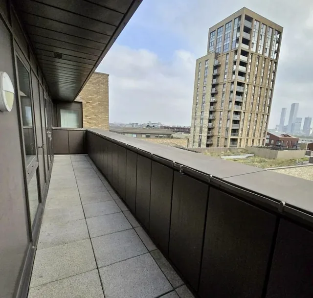 Tiled balcony with timber-clad soffit