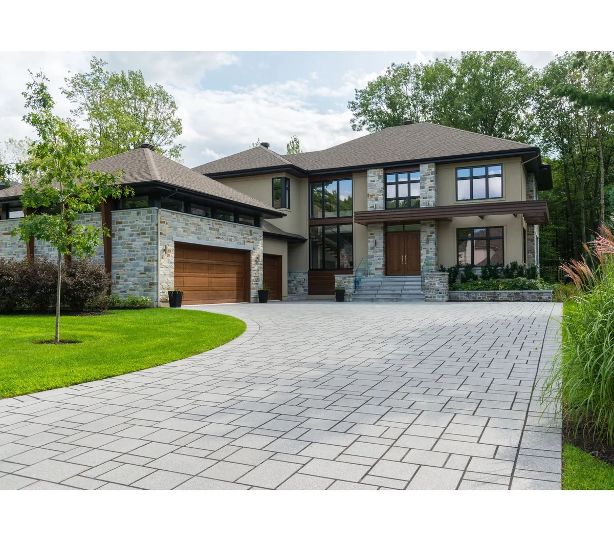 Stone and render family home with block-paved drive