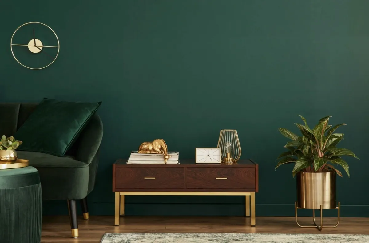 Deep green feature wall with sideboard