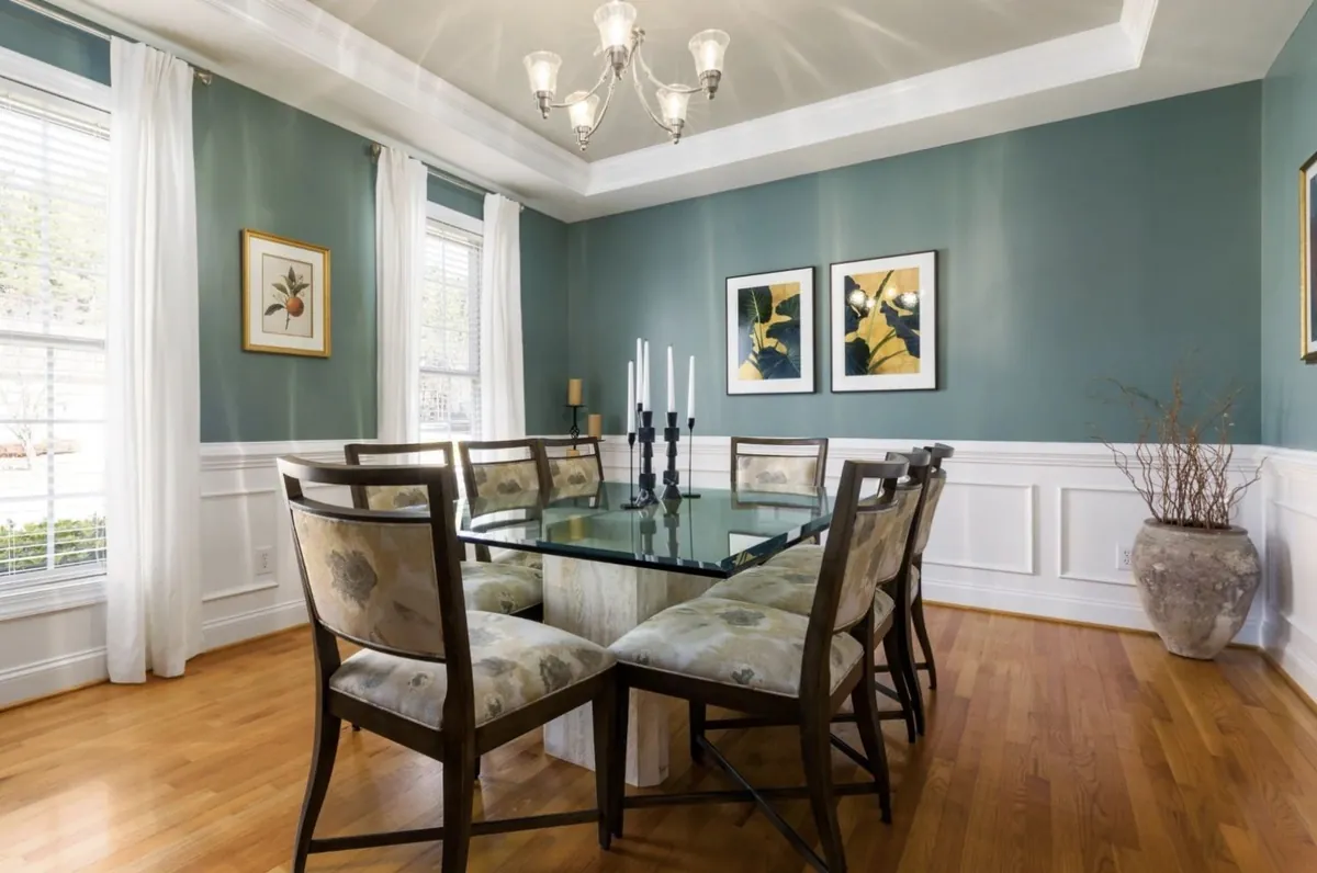 Dining room in soft blue with white wainscoting