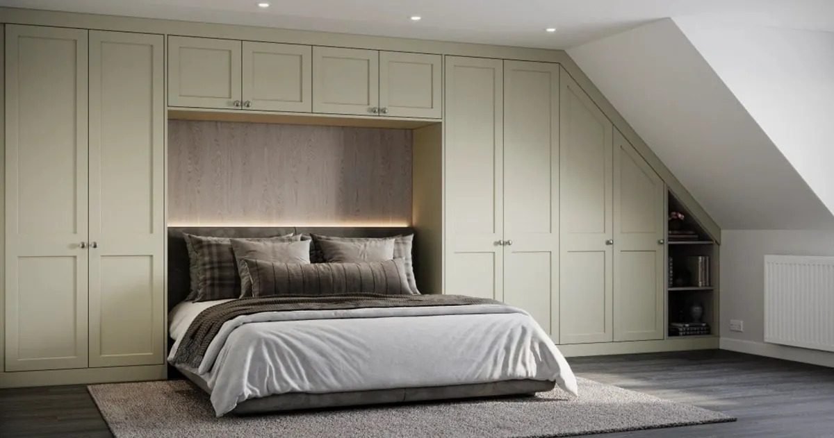 Loft bedroom with fitted painted wardrobes