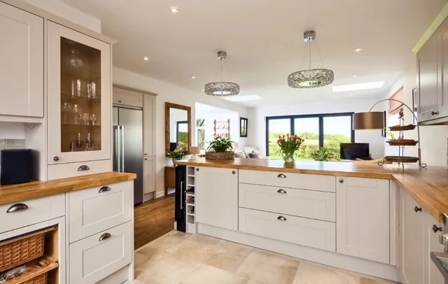 Cream country kitchen with oak worktops