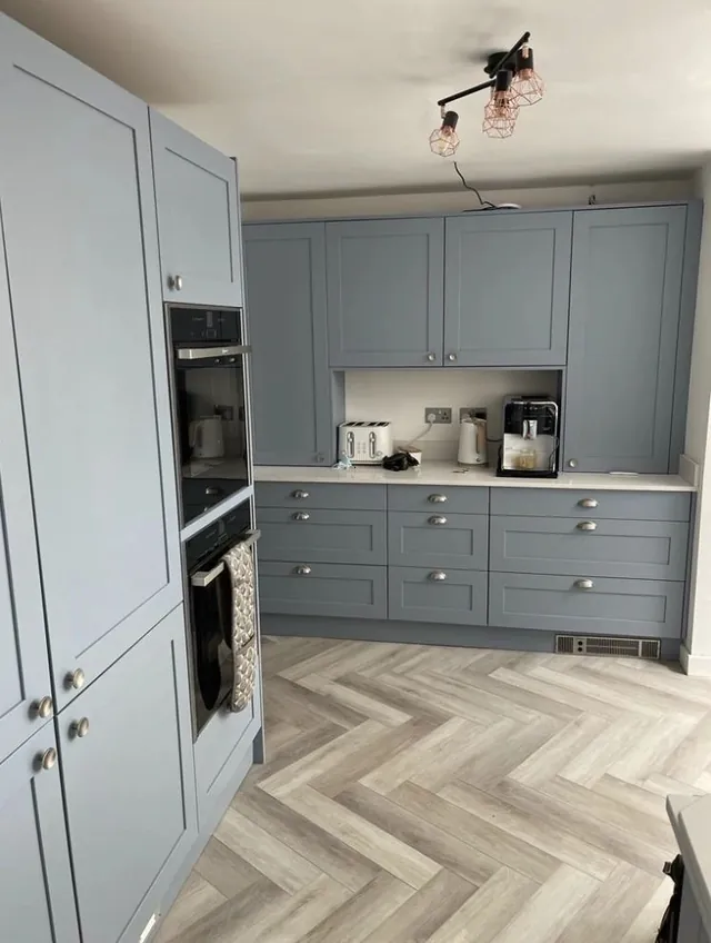 Grey shaker kitchen with herringbone floor