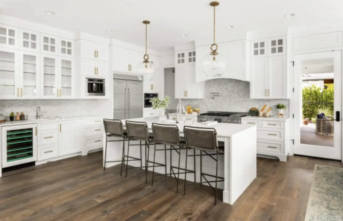White open-plan kitchen with large island