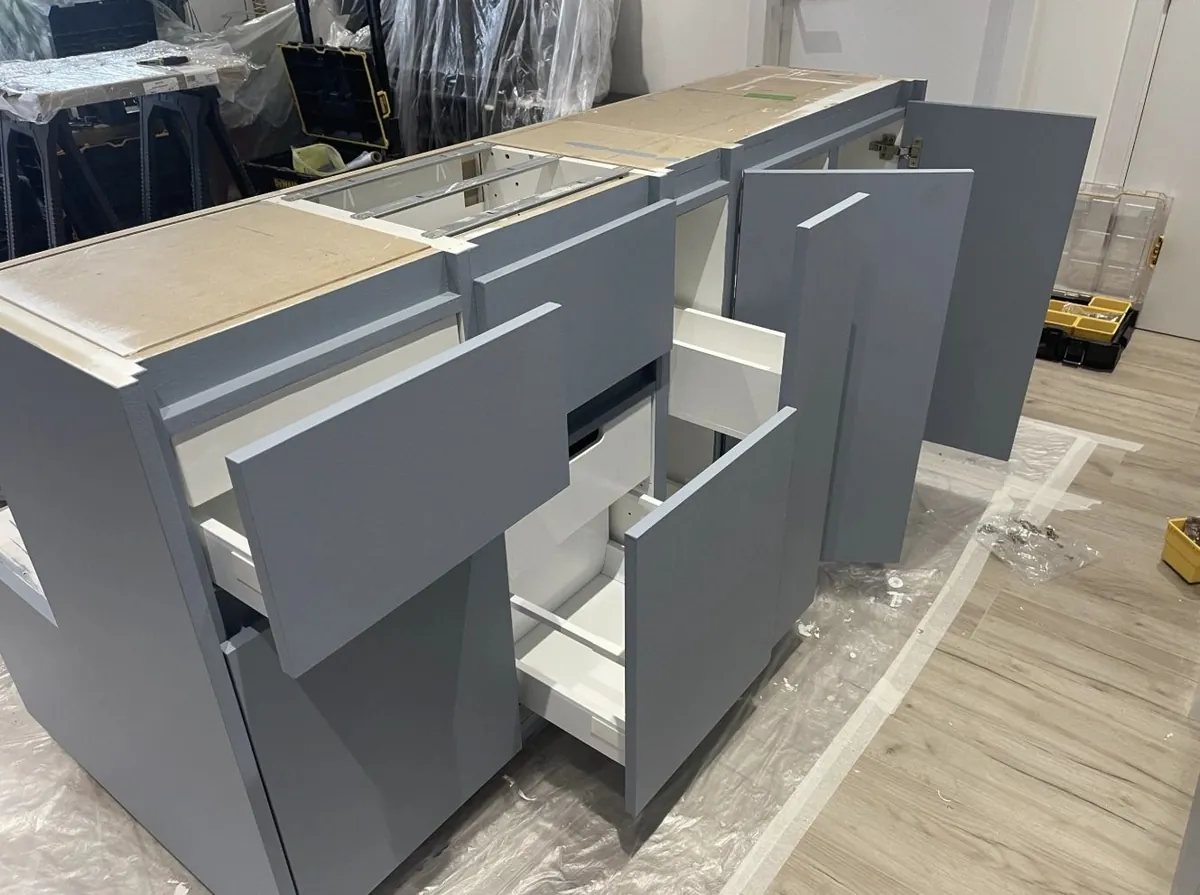 Soft-close drawers being fitted to the island